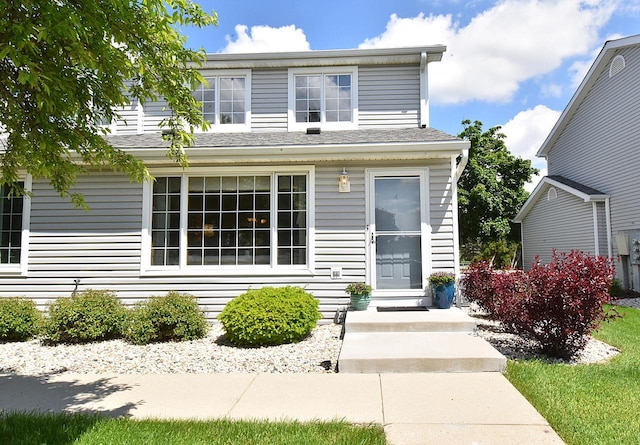 10320 W Whitnall Edge Cir Unit A, Franklin, WI 53132 - traditional home featuring a shingled roof