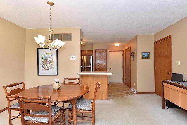 10320 W Whitnall Edge Cir Unit A, Franklin, WI 53132 - dining area with a chandelier, light carpet, baseboards, and a textured ceiling