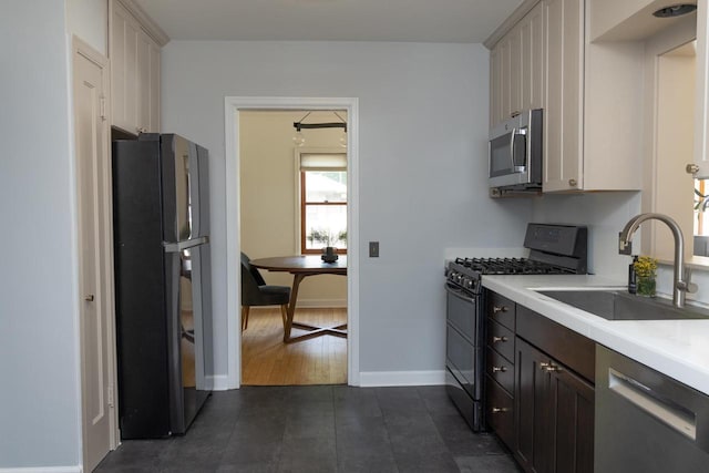 2707 Mason St, Madison, WI 53705 - kitchen featuring black appliances, light countertops, white cabinetry, and dark tile patterned floors