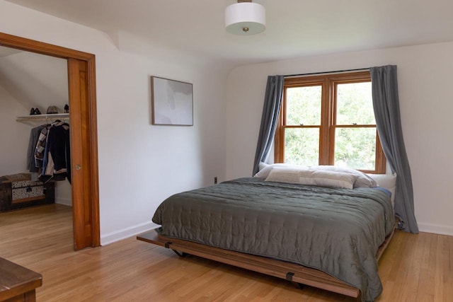 2707 Mason St, Madison, WI 53705 - bedroom featuring light wood finished floors, a closet, and a spacious closet