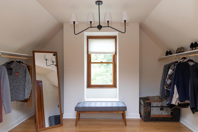 2707 Mason St, Madison, WI 53705 - spacious closet with vaulted ceiling, wood finished floors, and a chandelier