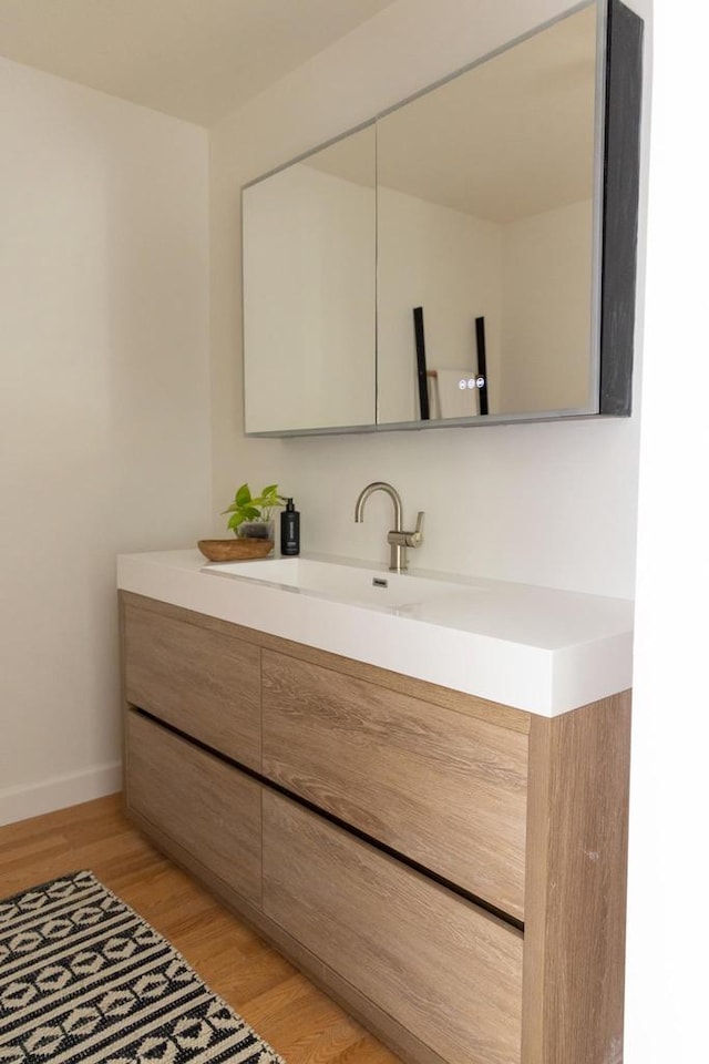 2707 Mason St, Madison, WI 53705 - bathroom featuring vanity and wood finished floors