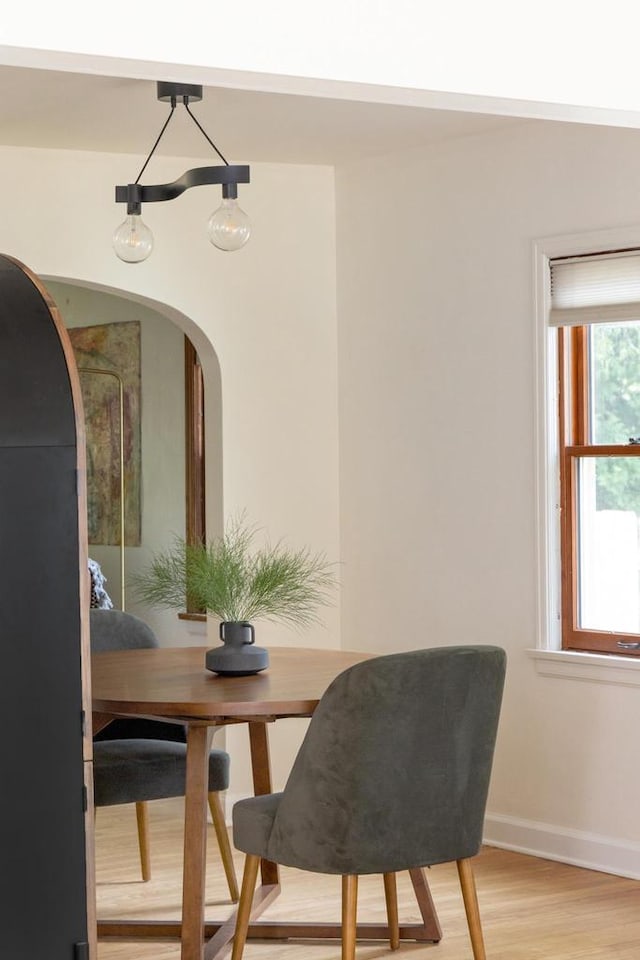 2707 Mason St, Madison, WI 53705 - dining area featuring light wood finished floors and arched walkways