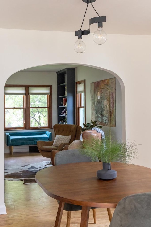 2707 Mason St, Madison, WI 53705 - dining space with arched walkways and wood finished floors