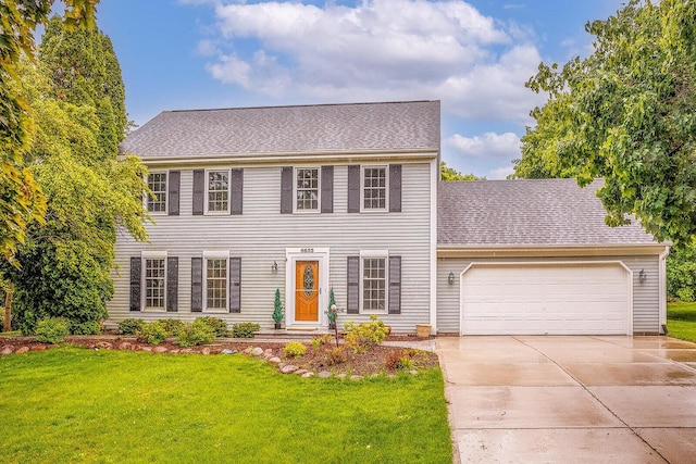 6633 W Beacon Hill Pl, Franklin, WI 53132 - colonial-style house with driveway, an attached garage, a front yard, and a shingled roof
