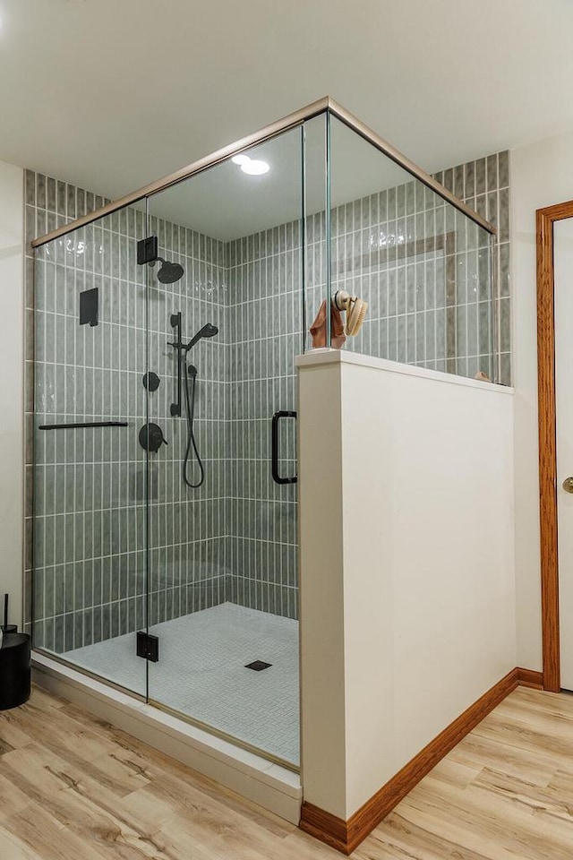 6633 W Beacon Hill Pl, Franklin, WI 53132 - full bath featuring wood finished floors, a shower stall, and baseboards