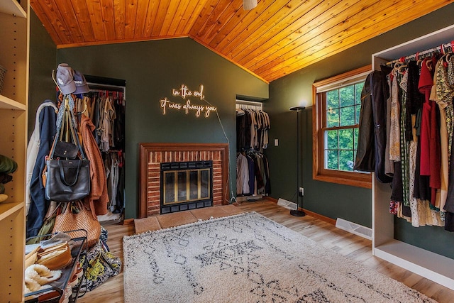 6633 W Beacon Hill Pl, Franklin, WI 53132 - living area with lofted ceiling, wood ceiling, a fireplace, wood finished floors, and baseboards