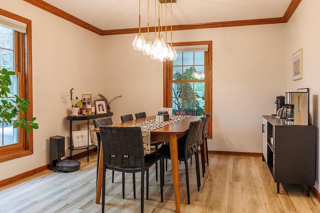 6633 W Beacon Hill Pl, Franklin, WI 53132 - dining area featuring light wood-style floors, ornamental molding, plenty of natural light, and a chandelier