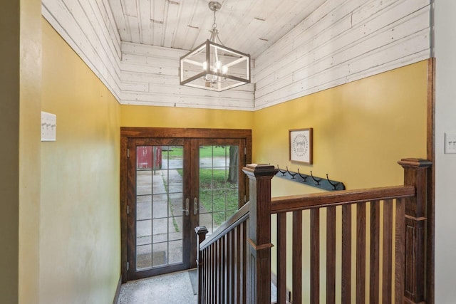 N62W23527 Sliver Spring Dr, Sussex, WI 53089 - entrance foyer with wood ceiling, a chandelier, and french doors