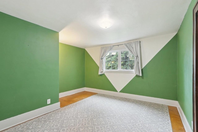 N62W23527 Sliver Spring Dr, Sussex, WI 53089 - additional living space with baseboards and wood finished floors