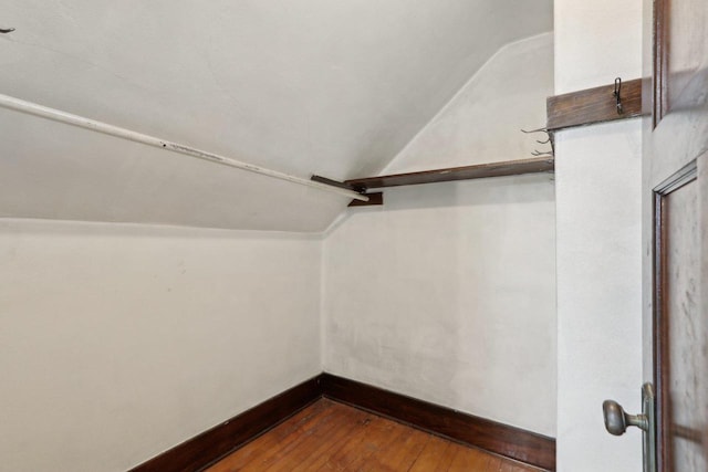 N62W23527 Sliver Spring Dr, Sussex, WI 53089 - spacious closet featuring vaulted ceiling and dark wood finished floors