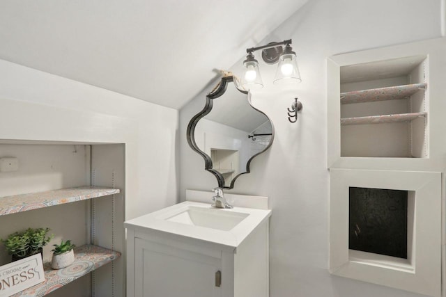 N62W23527 Sliver Spring Dr, Sussex, WI 53089 - bathroom featuring vanity and vaulted ceiling