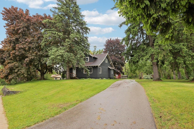 N62W23527 Sliver Spring Dr, Sussex, WI 53089 - view of front of property with a front yard and driveway