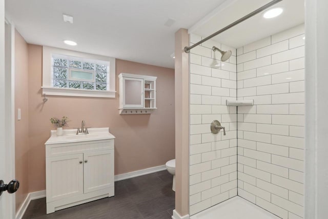 N62W23527 Sliver Spring Dr, Sussex, WI 53089 - full bathroom with vanity, toilet, a tile shower, baseboards, and recessed lighting