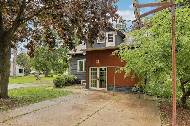 N62W23527 Sliver Spring Dr, Sussex, WI 53089 - rear view of property featuring french doors and a lawn