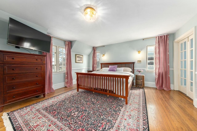 529 N 68th St, Wauwatosa, WI 53213 - bedroom featuring light wood-style flooring, multiple windows, and baseboards