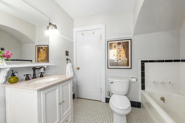 529 N 68th St, Wauwatosa, WI 53213 - full bath featuring vanity, a bath, toilet, tile patterned floors, and baseboards