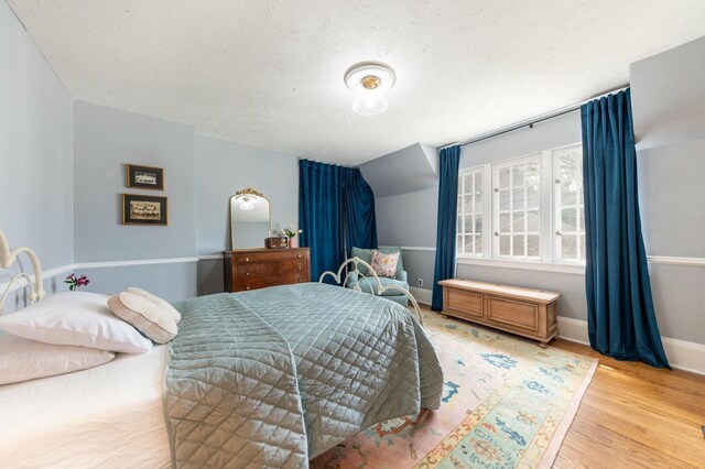 529 N 68th St, Wauwatosa, WI 53213 - bedroom with wood finished floors and a textured ceiling