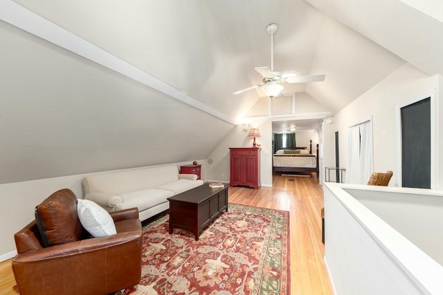 529 N 68th St, Wauwatosa, WI 53213 - living area with vaulted ceiling, light wood finished floors, ceiling fan, and baseboards
