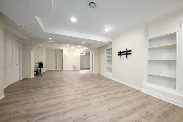 529 N 68th St, Wauwatosa, WI 53213 - below grade area featuring arched walkways, baseboards, built in features, recessed lighting, and crown molding