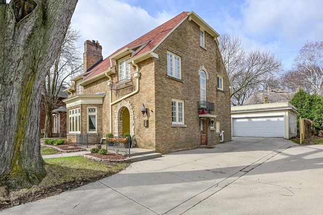 529 N 68th St, Wauwatosa, WI 53213 - view of front of property featuring a chimney, brick siding, and a detached garage