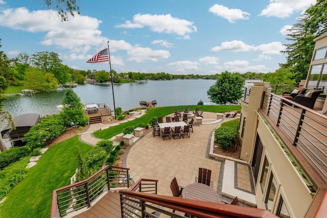 N49W35398 Wisconsin Ave, Oconomowoc, WI 53066 - view of patio / terrace with outdoor dining space, a water view, and a dock