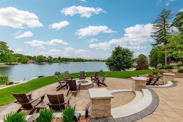 N49W35398 Wisconsin Ave, Oconomowoc, WI 53066 - view of patio with an outdoor fire pit and a water view