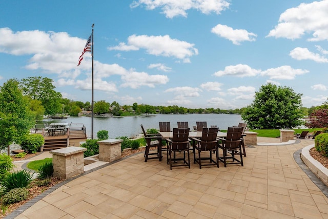 N49W35398 Wisconsin Ave, Oconomowoc, WI 53066 - view of patio / terrace featuring outdoor dining area and a water view