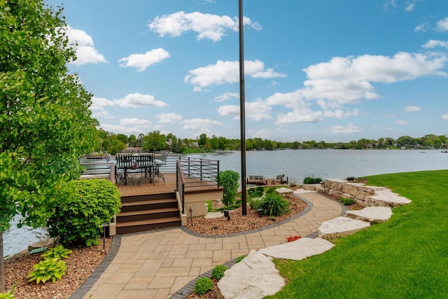 N49W35398 Wisconsin Ave, Oconomowoc, WI 53066 - view of patio with a deck with water view and outdoor dining area