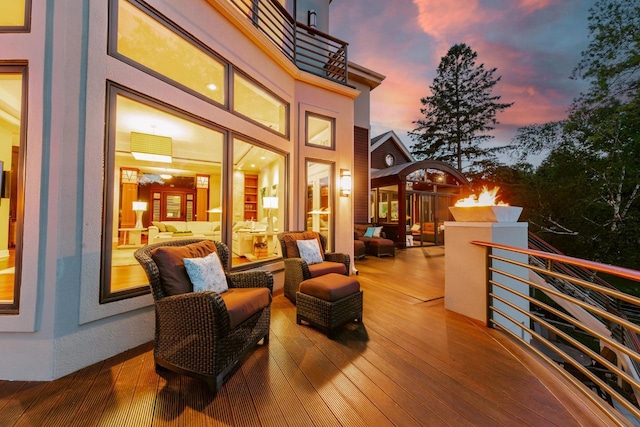 N49W35398 Wisconsin Ave, Oconomowoc, WI 53066 - deck at dusk with an outdoor living space