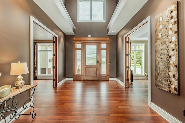 N49W35398 Wisconsin Ave, Oconomowoc, WI 53066 - foyer entrance with baseboards and dark wood-style floors