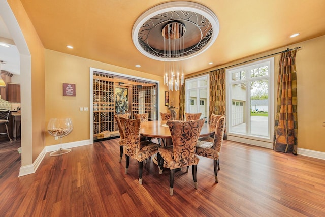 N49W35398 Wisconsin Ave, Oconomowoc, WI 53066 - dining space with wood finished floors, baseboards, recessed lighting, a chandelier, and arched walkways