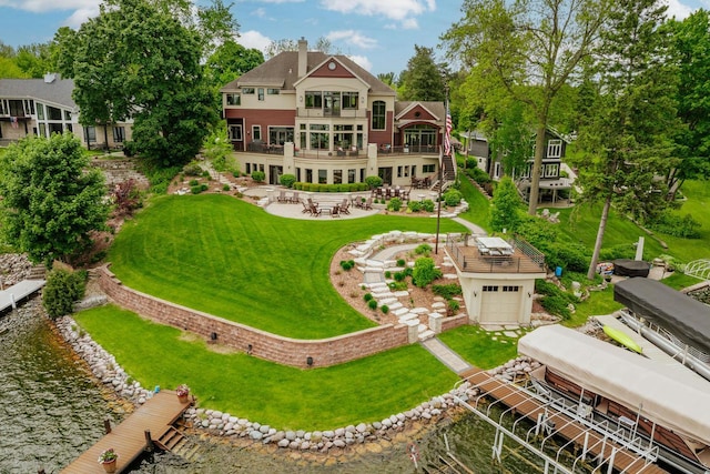 N49W35398 Wisconsin Ave, Oconomowoc, WI 53066 - back of property with a yard, boat lift, a patio area, a balcony, and stairs