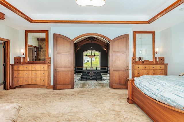 N49W35398 Wisconsin Ave, Oconomowoc, WI 53066 - bedroom featuring light colored carpet, a raised ceiling, and arched walkways