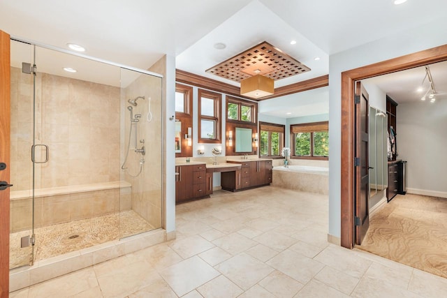 N49W35398 Wisconsin Ave, Oconomowoc, WI 53066 - full bath featuring recessed lighting, vanity, a stall shower, a bath, and baseboards