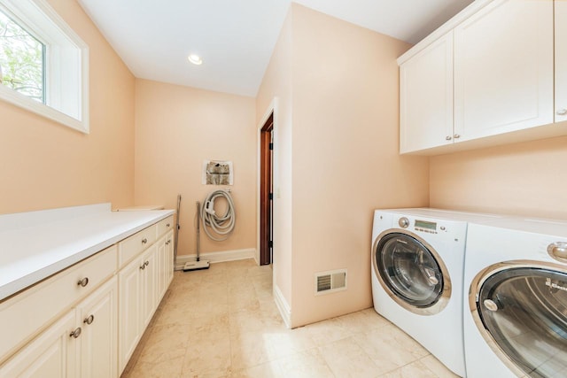 N49W35398 Wisconsin Ave, Oconomowoc, WI 53066 - laundry area with cabinet space, washer and dryer, and baseboards