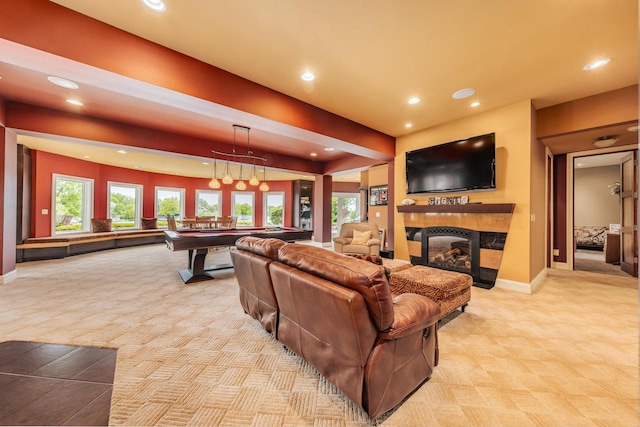 N49W35398 Wisconsin Ave, Oconomowoc, WI 53066 - living area featuring light colored carpet, billiards table, recessed lighting, baseboards, and a tiled fireplace