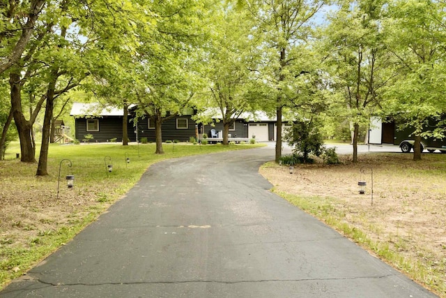 29774 Whispering Pines Rd, Lone Rock, WI 53556 - view of front of property with a front yard, asphalt driveway, and a garage