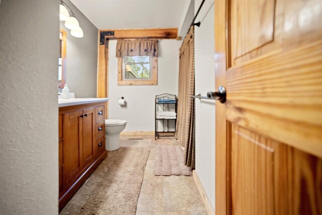 29774 Whispering Pines Rd, Lone Rock, WI 53556 - full bathroom with vanity, toilet, and baseboards