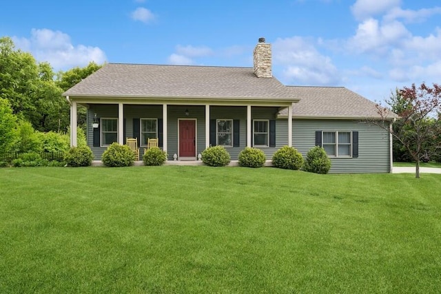 W522 Highland Rd, Genoa City, WI 53128 - view of front of property featuring a chimney, a front yard, a porch, and roof with shingles