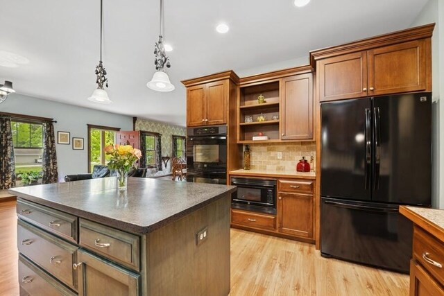 W522 Highland Rd, Genoa City, WI 53128 - kitchen featuring black appliances, open shelves, dark countertops, light wood-style flooring, and tasteful backsplash