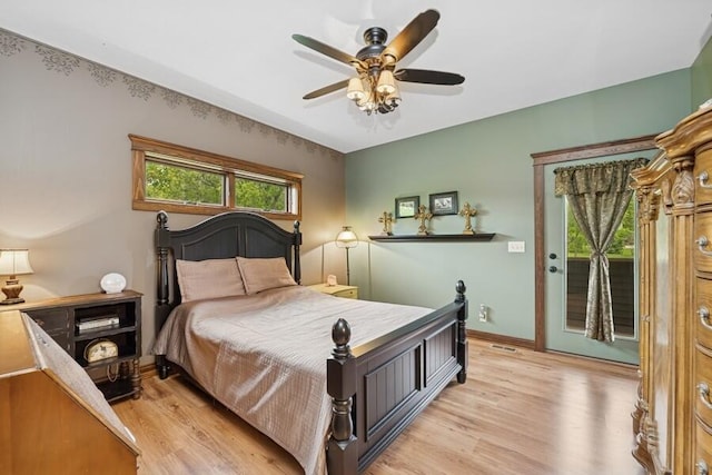 W522 Highland Rd, Genoa City, WI 53128 - bedroom with light wood-style flooring, access to exterior, baseboards, and a ceiling fan