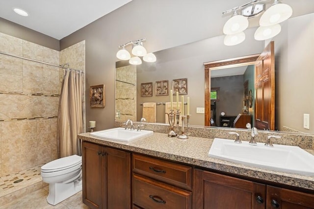 W522 Highland Rd, Genoa City, WI 53128 - bathroom with toilet, double vanity, tiled shower, and tile patterned floors