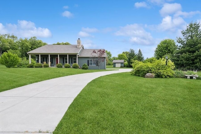 W522 Highland Rd, Genoa City, WI 53128 - single story home with a front lawn, a chimney, and concrete driveway