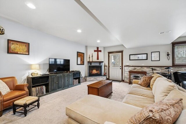 W522 Highland Rd, Genoa City, WI 53128 - carpeted living room with a warm lit fireplace and recessed lighting