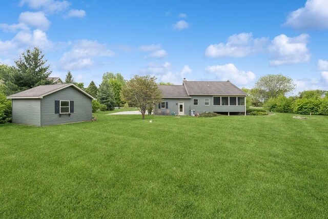 W522 Highland Rd, Genoa City, WI 53128 - view of green lawn with a sunroom