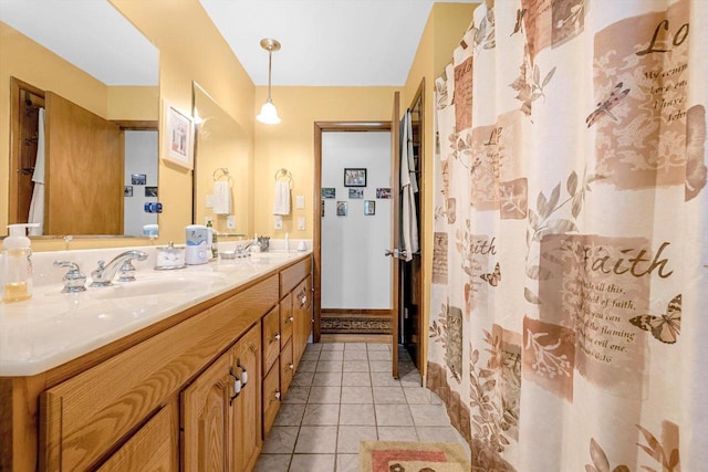 3005 S St, East Troy, WI 53120 - bathroom with double vanity, tile patterned flooring, and baseboards