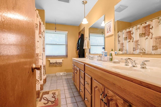 3005 S St, East Troy, WI 53120 - bathroom featuring double vanity, tile patterned flooring, and baseboards
