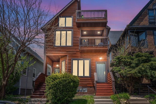 518-520 E Glover Ave, Milwaukee, WI 53212 - rustic home with a balcony, stairway, and entry steps