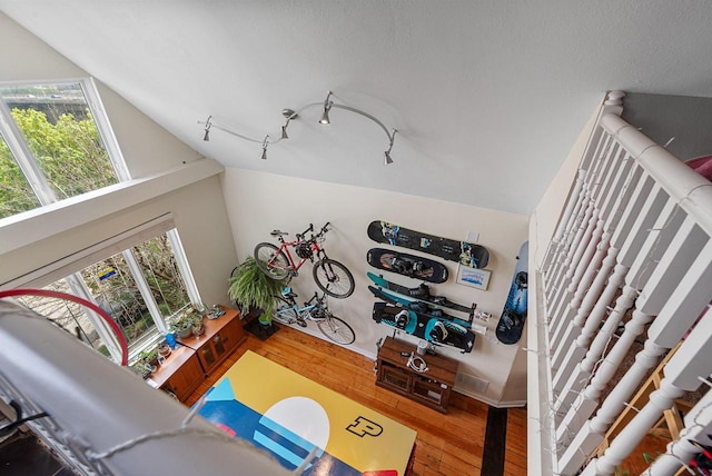 518-520 E Glover Ave, Milwaukee, WI 53212 - living area featuring plenty of natural light, hardwood / wood-style flooring, vaulted ceiling, and baseboards